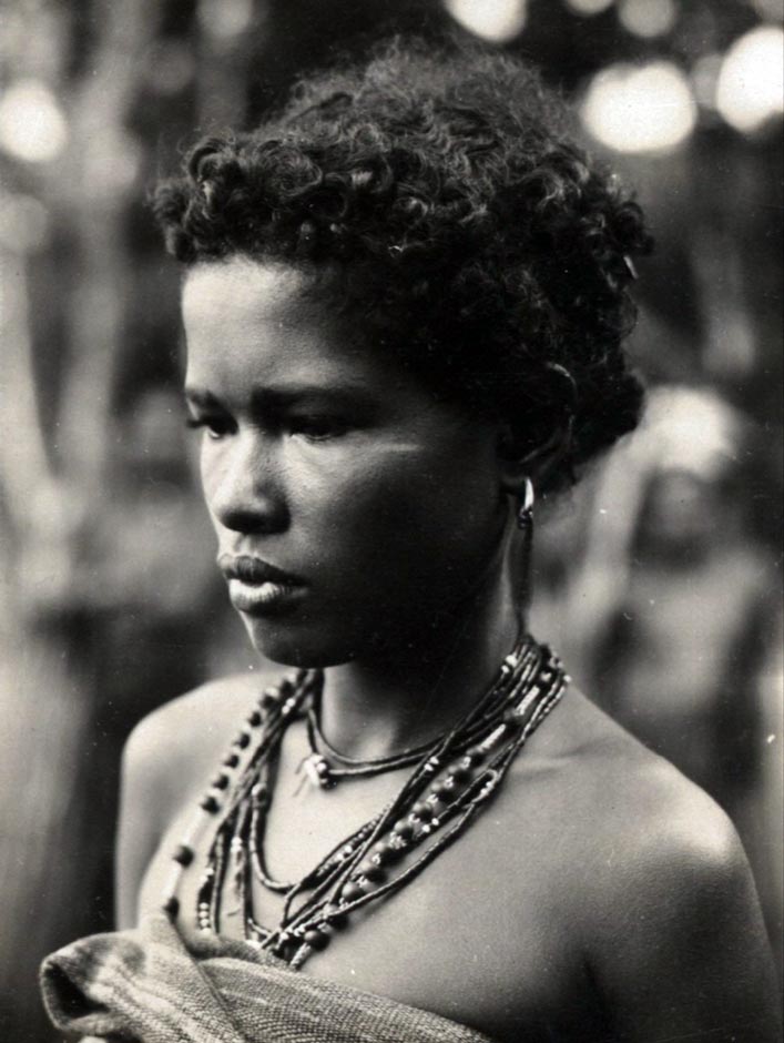 Description: A woman from Lewoloba wearing necklaces