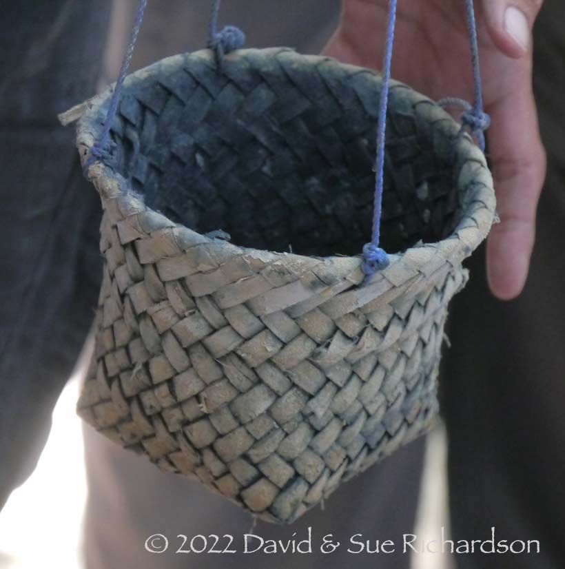 Description: A small indigo straining basket