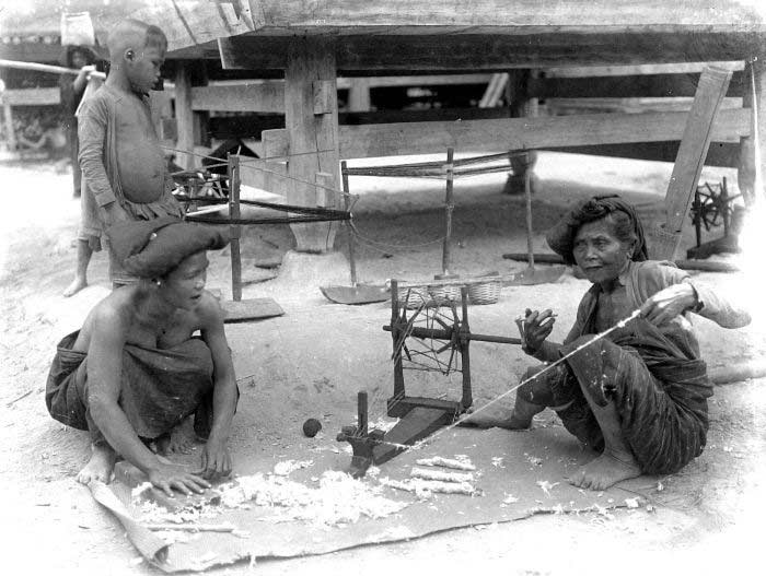 Description: Karo Batak women spinning cotton