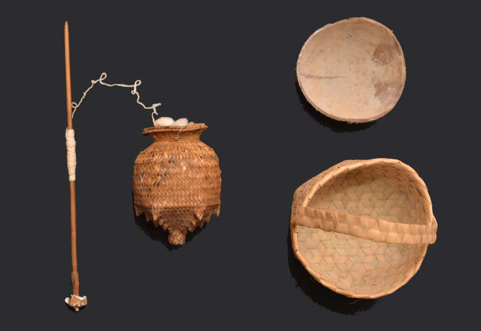 Description: An Oirata drop spindle, rolag basket, coconut shell and ash basket