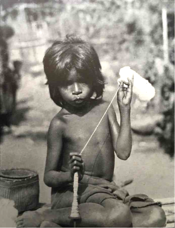 Description: A young girl spinning in Karang Ora