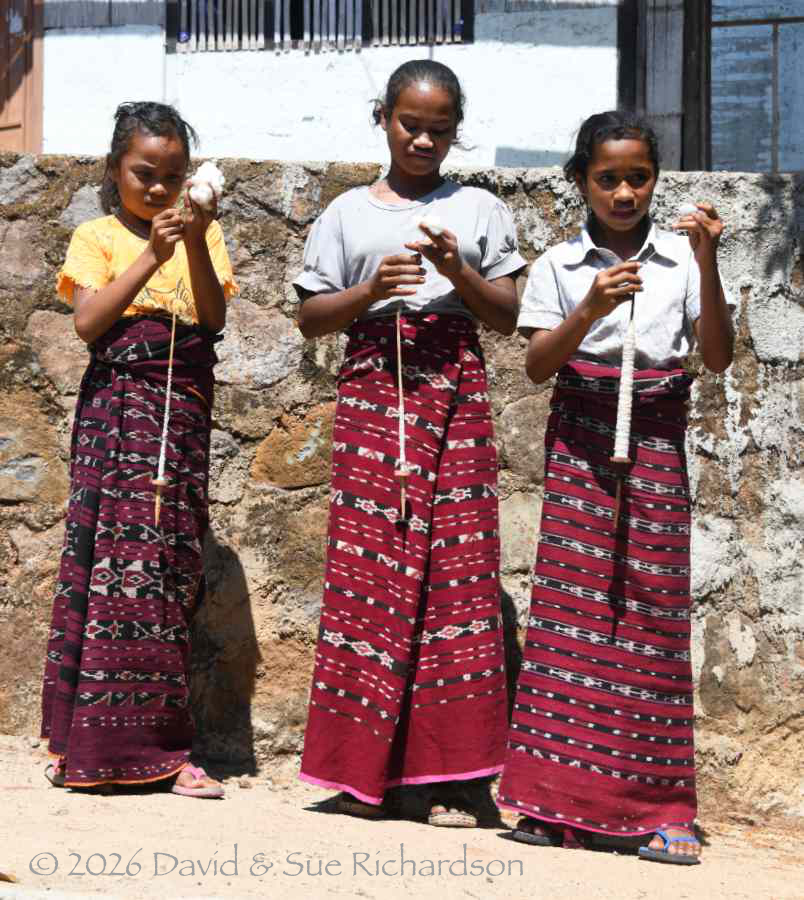 Description: Three young girls drop spinning at Atawolo